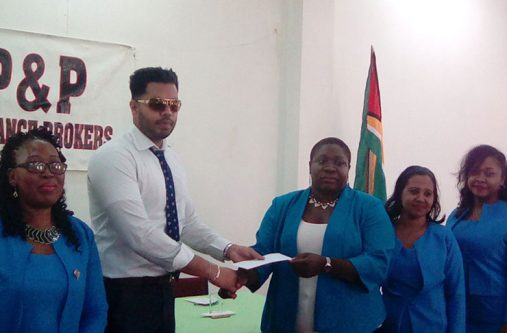 Library Chief Librarian Emiley King accepts contributions by P&P’ representative on behalf of the National Library