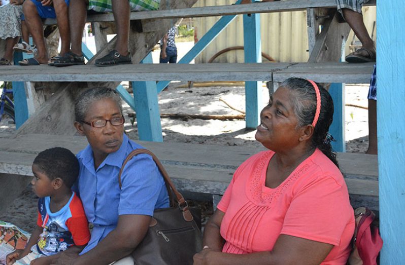 An elderly villager speaking about her problems