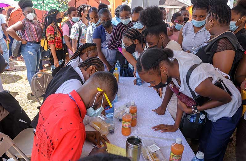 Persons being registered for job openings at the newly opened call centre at Kara Kara (Delano Williams photo)