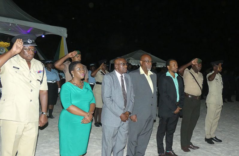 The Region 10 Officials standing at attention as the Golden Arrow Head was hoisted