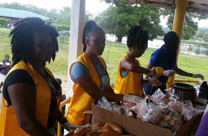 Linden Lions Club members volunteering their services in a feeding programme