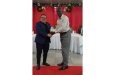 Linden Matthews (left), receives his award from Guyana Cricket Board president, Bissondial Singh