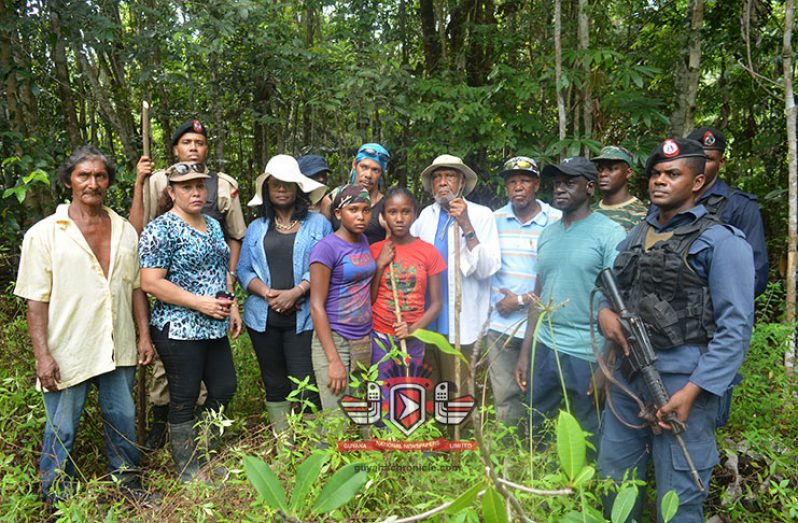Justice Trotman and members of the team standing at the camp at Lindo Creek in the Upper Berbice River