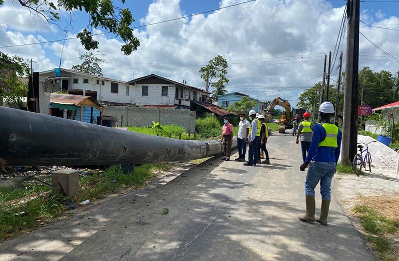 GWI’s Shaik Baksh and team witnessing one of the 22 HDPE lines being laid