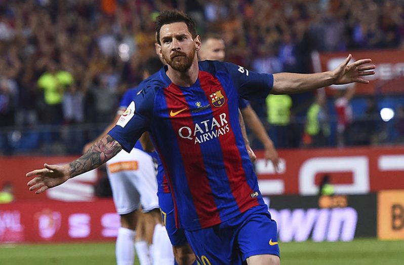 Barcelona's Lionel Messi celebrates scoring their third goal. (REUTERS/Juan Medina)
