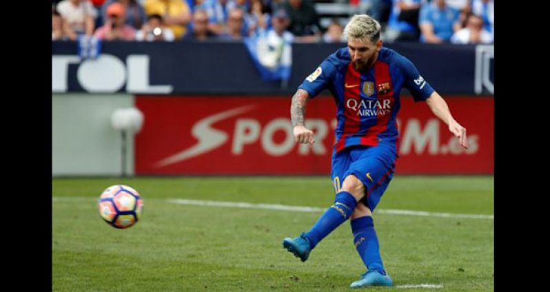 Barcelona's Lionel Messi scores a goal from the penalty spot. REUTERS/Sergio Perez