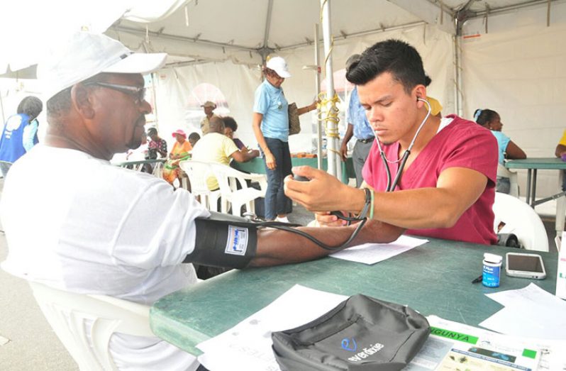 A member of the public having his blood pressure tested