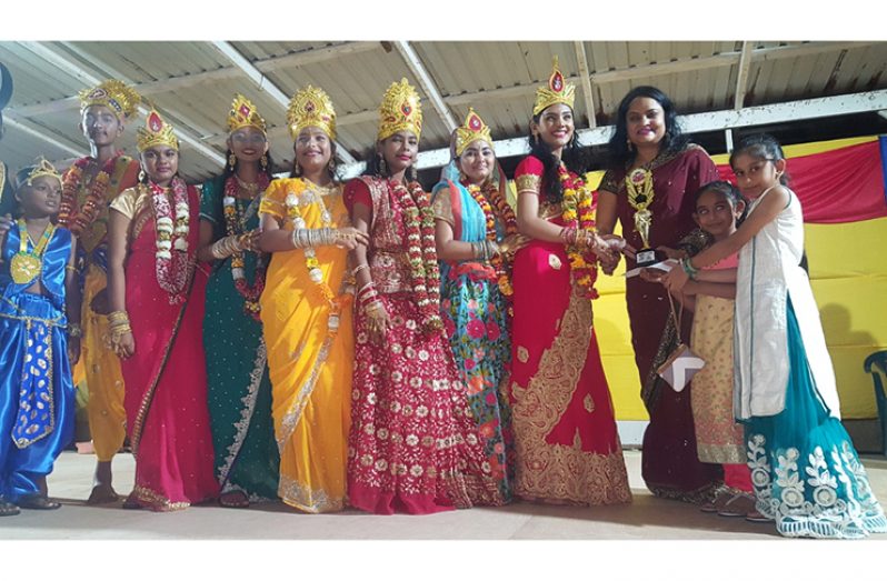 President of the Guyana Hindu Dharmic Sabha, Dr Vindhya Persaud presenting the first prize to members of the Spring Garden Mandir