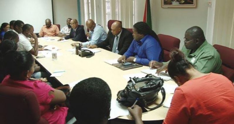 Minister Raphael Trotman and team meeting with representatives of the logging community of Region 10