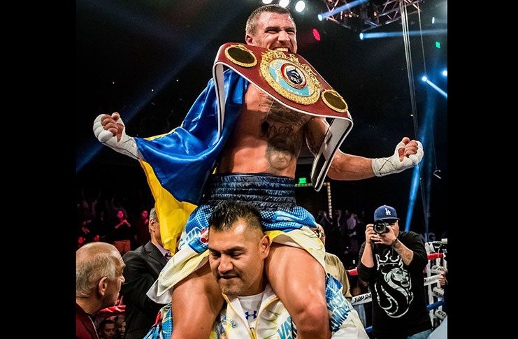Vasyl Lomachenko celebrates with championship belt after beating Nicholas Walters
at the Cosmopolitan, Las Vegas Saturday night