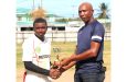 DCB official Shawn Massiah presents Lomar Seecharran his Man-of-the-Match trophy at LBI