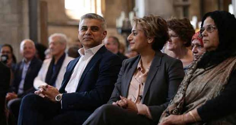 Sadiq Khan (L) and his wife Saadiya attend the signing ceremony for the newly elected Mayor of London, in Southwark Cathedral, London, Britain, May 7, 2016. REUTERS/Yui Mok/Pool