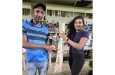 The lucky fan on the left received the bat from Annalisa Beharry, a representative of the project