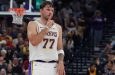 Luka Doncic of the Los Angeles Lakers hushes the crowd after sinking a three pointer during the 132-123 win over the Utah Jazz
