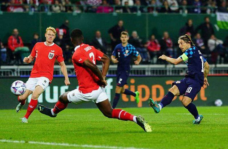 Croatia midfielder Luka Modric (right) shoots to score the opening goal during the UEFA Nations League (A) Group 1 football match versus Austria in Vienna, Austria, on Sunday. (Photo: AFP)