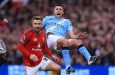 Manchester United defender Luke Shaw tackles Manchester City midfielder Rodri at Old Trafford