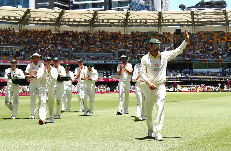 Off-spinner Nathan Lyon leads Australia off the field after becoming just the third Aussie bowler to claim 400 Test wickets, after Shane Warne and Glenn McGrath (Photo: Getty Images)