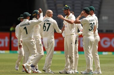 Nathan Lyon is mobbed by his team-mates after striking early on the final day  •  (AFP/Getty Images)
