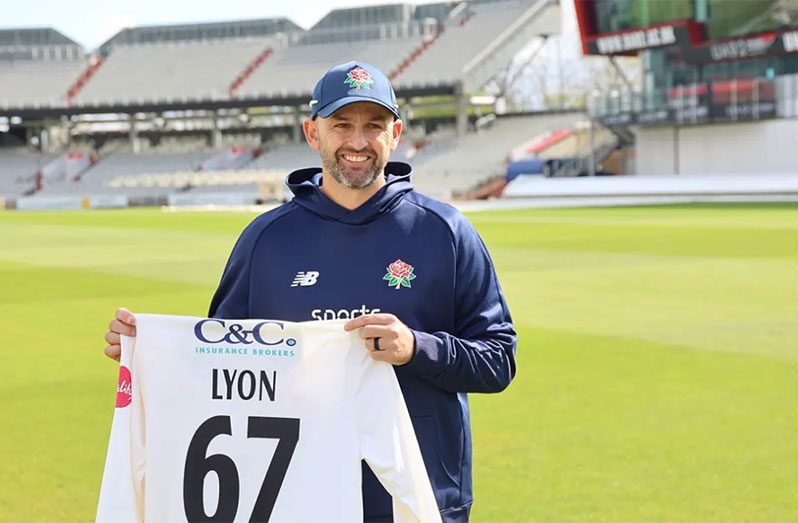 Nathan Lyon poses with his Lancashire shirt  •  (Lancashire Cricket)