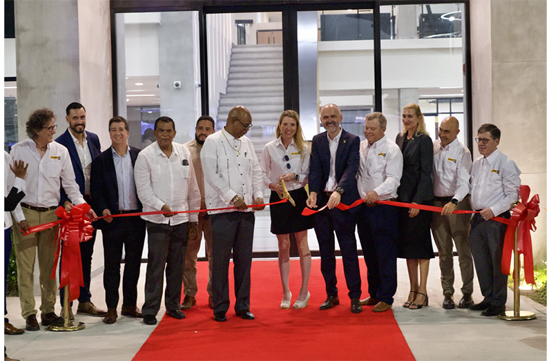 Minister of Public Works Bishop Juan Edghill and President of MACORP Guyana Inc German Consuegra and other officials cut the ribbon to formally commission the company's new US$35 million integrated industrial complex at Covent Garden, East Bank Demerara on Thursday