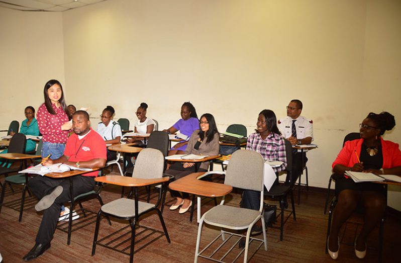 Mandarin instructor Connie Zhao addresses her class of students at the Guyana Police Force's (GPF) Training Centre (Adrian Narine photo)