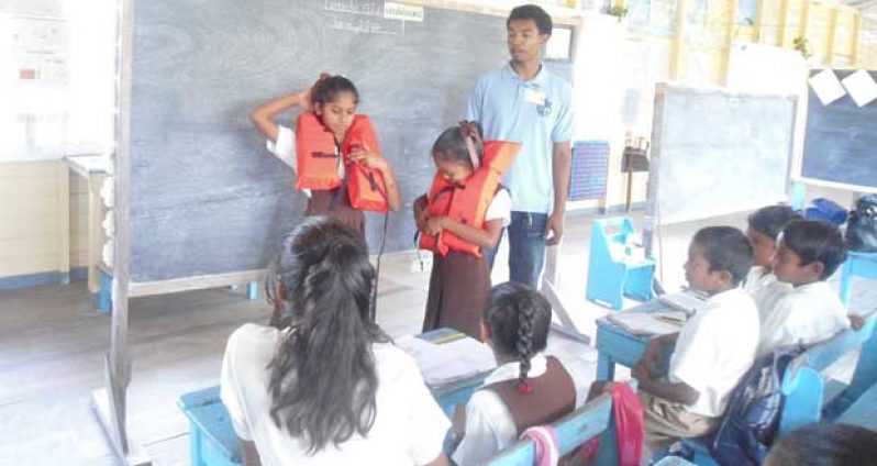 Students being outfitted with lifejackets.