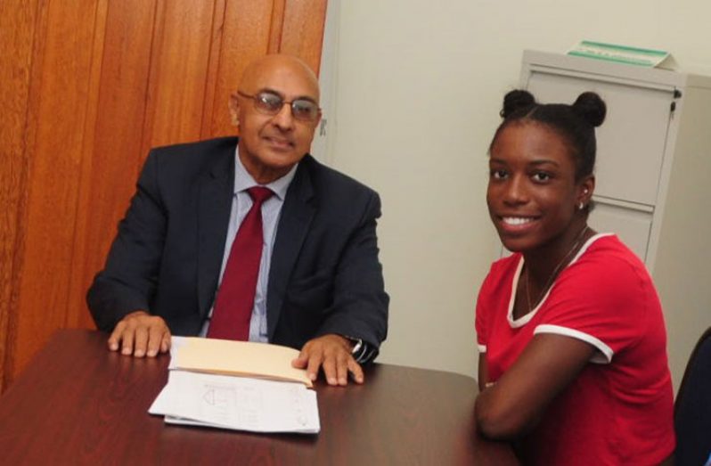 GOA president Juman Yassin (right) and tennis player Sachia Vickery at their meeting at Olympic House yesterday. (Delano Williams photo)