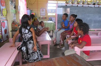 Melinda Blaise conducting a session for some of the youngest residents in Baramita during an outreach event.