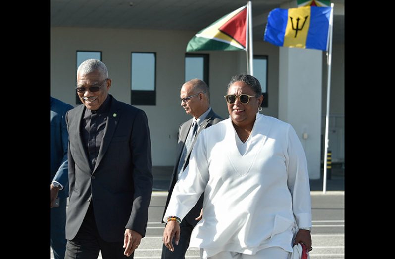 President David Granger and Barbados'Prime Minister, the Honourable Mia Amor Mottley at the Cheddi Jagan International Airport, Timehri