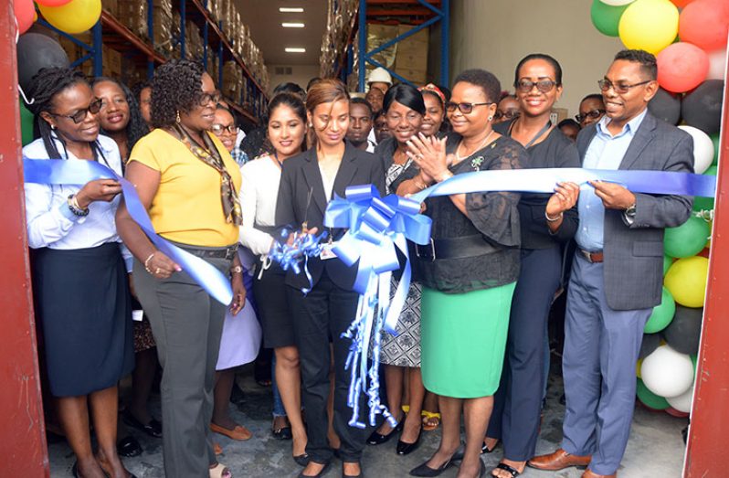 Minister of Public Health, Volda Lawrence and other officials cut the ceremonial ribbon to officially commission the facility (Adrian Narine photo)