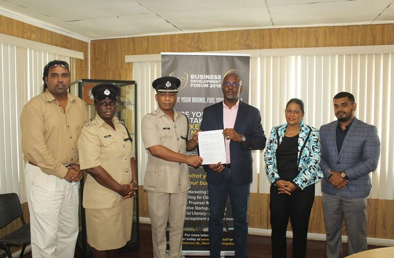 From left: Head of the GPF's Corporate Communications Unit, Mark Ramotar; Head of the GPF's Strategic Planning Unit, Nicola Kendall; Deputy Commissioner 'Administration' (ag),  Calvin Brutus; GCCI's Junior VP, Kester Hutson; Secretary/Chairperson of the Green Economy Committee of the GCCI, Shaleeza Shaw and GCCI's Executive Director, Richard Rambarran