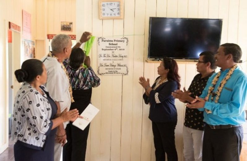 Minister of Education, Hon. Dr. Nicolette Henry, Minister of State, Dawn Hastings-Williams,
Regional Chairman, Gordon Bradford along with REdO Akbar Chindu and Headmistress
of Paruima Primary School unveiling the commissioning plaque