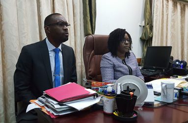 Director of Sport Christopher Jones (left) and Junior Minister of Public Health Dr Karen Cummings