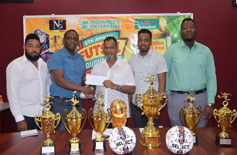 Aubrey Major Jr (second from left) receives the sponsorship cheque from Nazar Mohamed, in the presence of Kenrick Noel, Shareef Major and Ansa McAl's Jamal Baird.