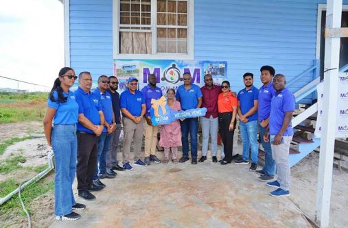 At centre, Zanita Persaud receives the keys on behalf of her husband to their brand-new house. She is flanked by (L) National Coordinator, Lieutenant Colonel Bhageshwar Murli; Minister of Labour and Manpower Planning, Keoma Griffith; Region Four Chairman, Juan Edghill and Permanent Secretary of the Ministry of Labour and Manpower Planning, Indranie Ramnaraine