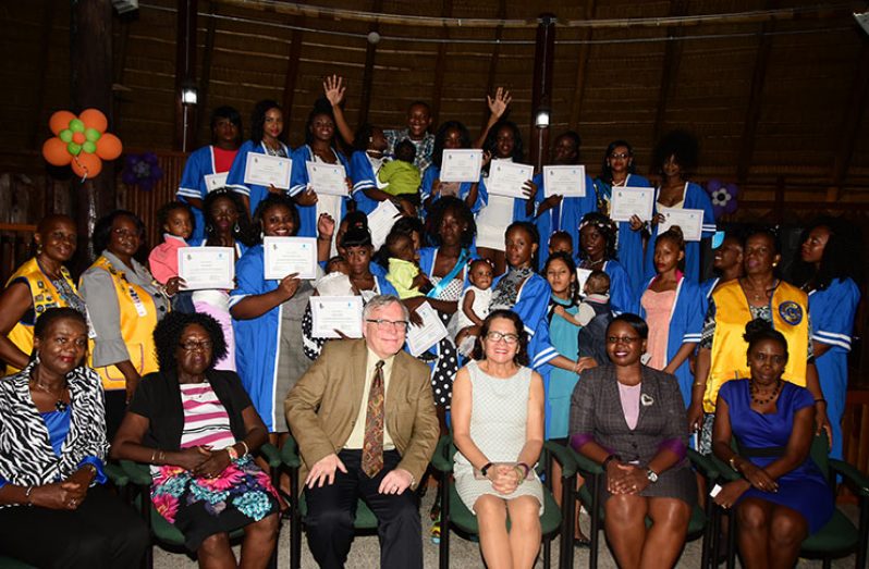 First Lady, Sandra Granger (seated fourth from left) with other officials and the graduates