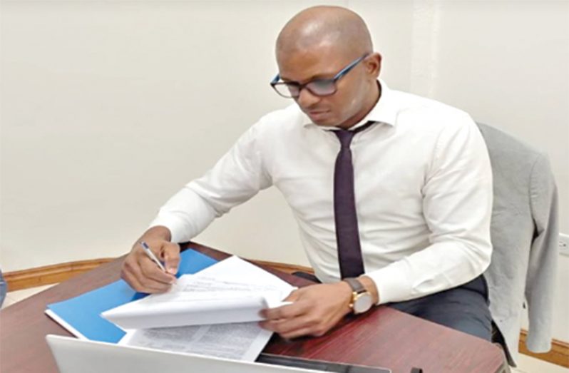 GTTA president Godfrey Munroe signing the agreement between STAG International and the GTTA.