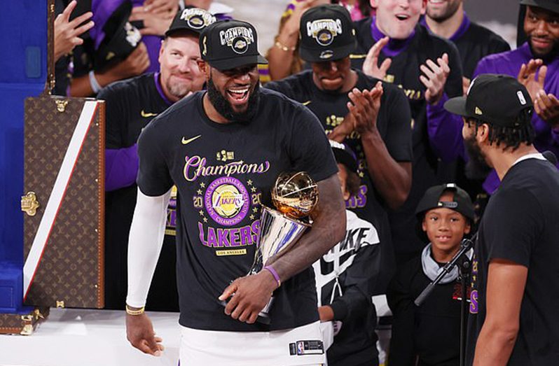 LeBron James holds his fourth NBA Finals MVP award, after the Lakers' victory on Sunday night.