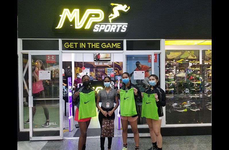 (L-R) Abosaide Cadogan along with a representative from MVP Sports, Sarah Klautky and Madison Fernandes at a simple presentation before their departure this week.