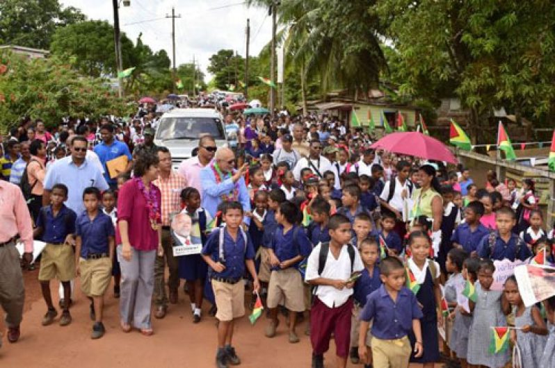 President Donald Ramotar and Education Minister, Priya Manickchand being given a rousing welcome on arrival at Mabaruma for the disbursement exercise