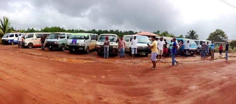 Some of the minibus operators and their vehicles at Mabaruma this morning .