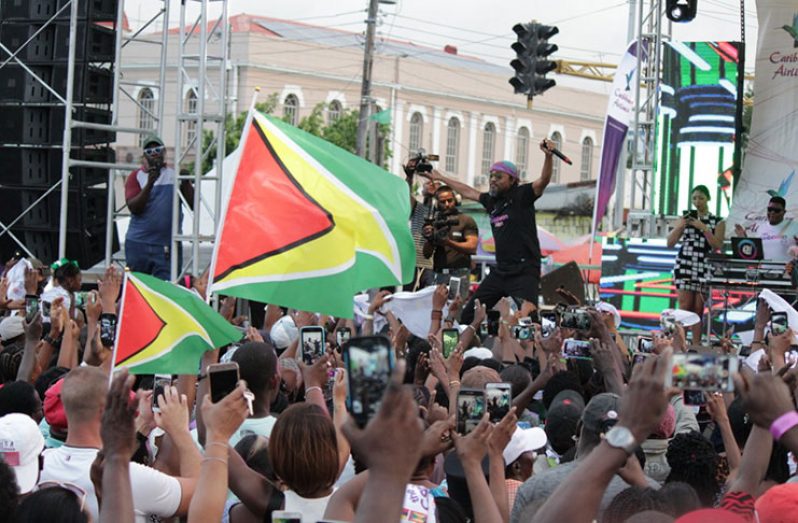 All hands, rags and flags in the air as Machel took the stage [Vishani Ragobeer photo]