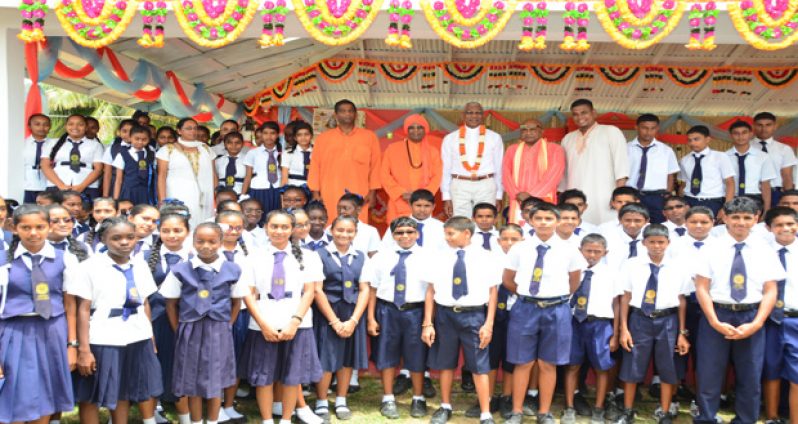 President David Granger with students of the Hindu College, swamis and officials of the Ashram
