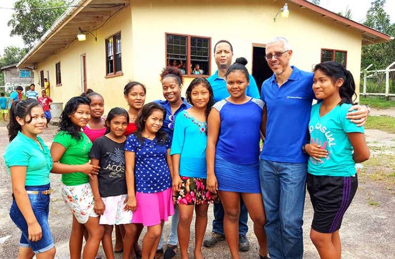 Minister Gaskin and others with female students at the Mahdia Secondary School hostel.