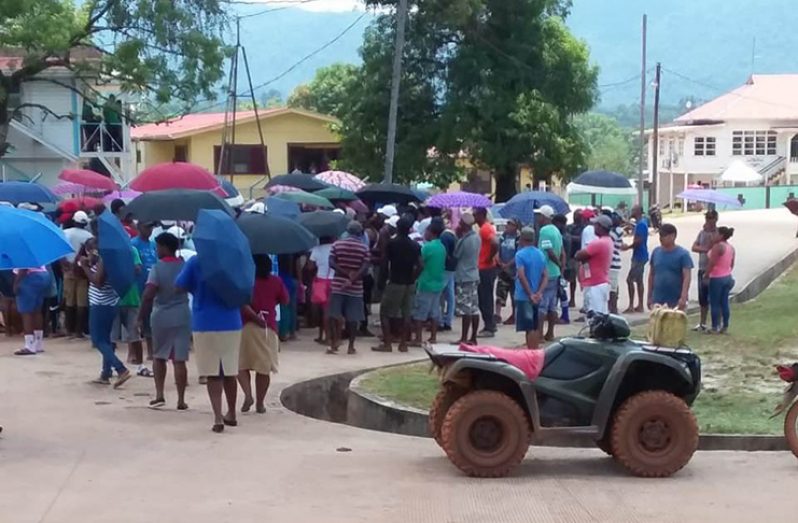 A large gathering of residents outside the office of the Guyana Geology and Mines Commission (GGMC) at Mahdia, as they protest the recent mining enforcement operation