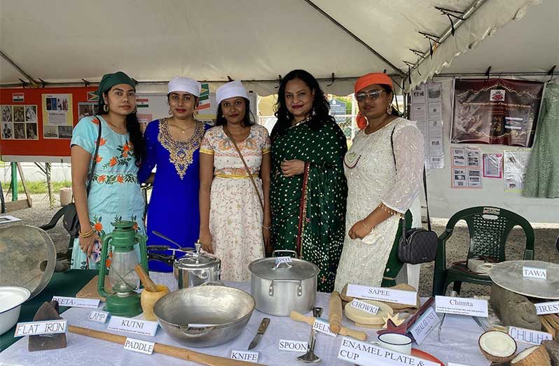 Members of Affiance Mandir showcasing traditional utensils