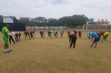 Coach Bharat Mangru looks on as the National female senior cricketers go through their paces during training session yesterday.