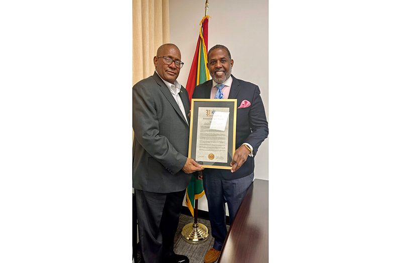 NYS Senator Kevin Parker (right) presents a proclamation to Consul General of Guyana to New York Michael E. Brotherson, at his Manhattan Office