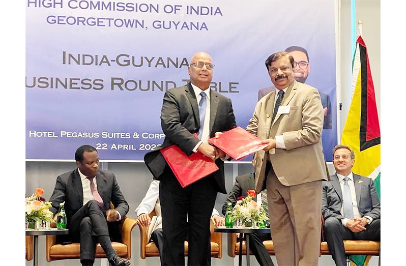 GOGEC President Manniram Prashad and CII’s Ravi Shankar Sriivasan exchange the MoU in the presence of India’s Minister of External Affairs Dr. Jaishaankar, and Guyana’s Foreign Affairs Minister Hugh Todd