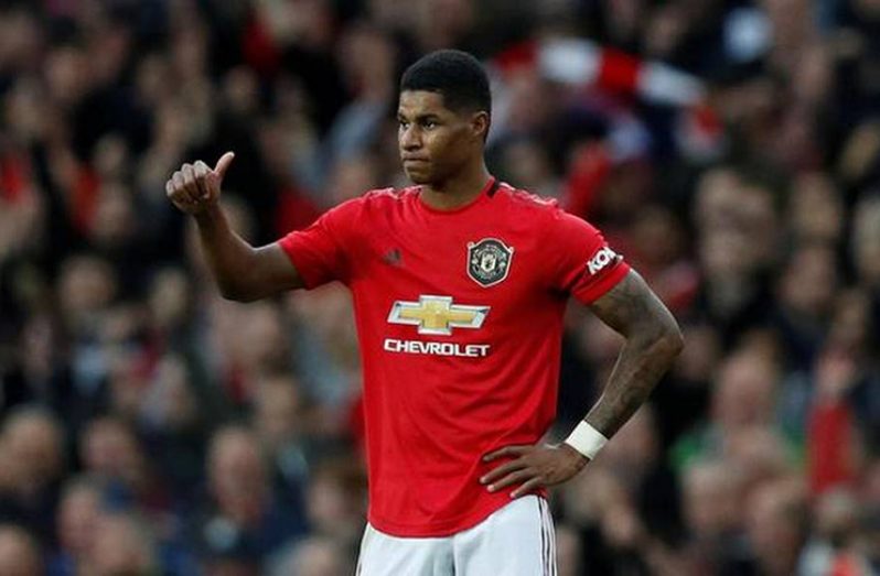 Manchester United's Marcus Rashford celebrates after scoring their first goal.